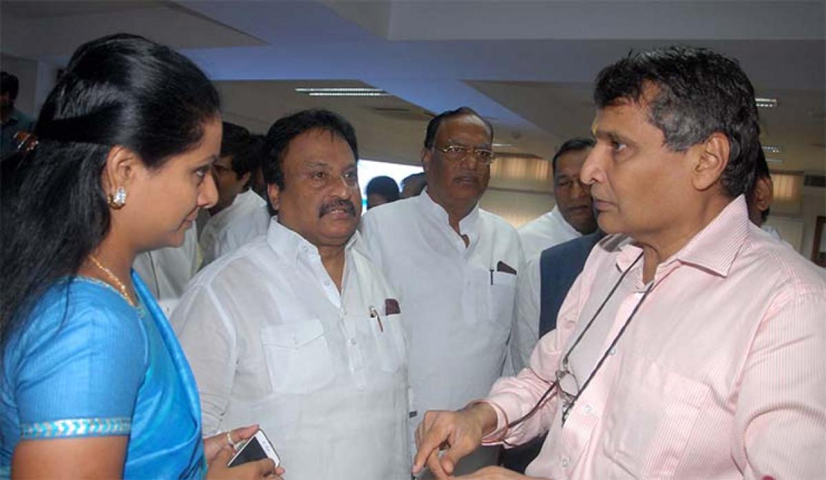 Union Railway Minister Suresh Prabhu with TRS MPs  K Kavitha and Jithender Reddy at the flagging off ceremony of new AC AP Express at Rail Bhavan in  New Delhi on Wednesday